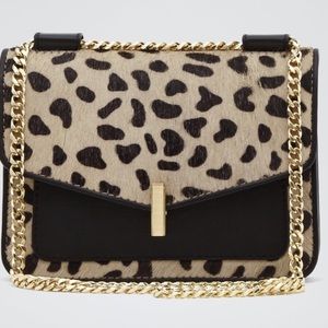 Reiss compact Elliott mini animal-print bag.